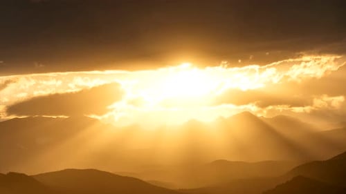 Time lapse of sun rays over the Rocky Mountains
