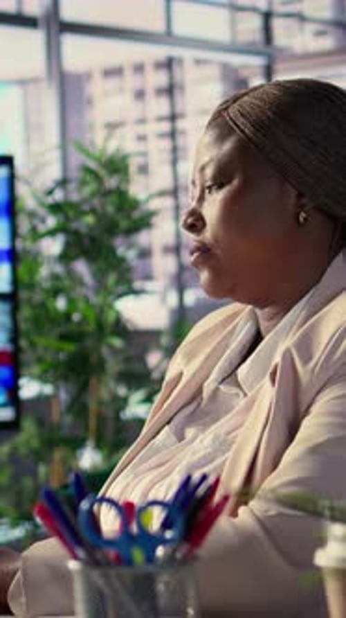Vertical Video African American Woman in a Powerful Role Oversees Budget Analysis