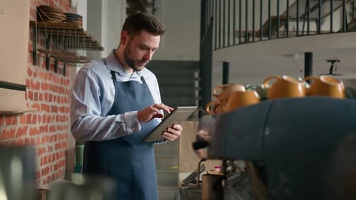 Caucasian Man Waiter Barista Cafe Owner Businessman Using Digital Tablet to Manage Small Business