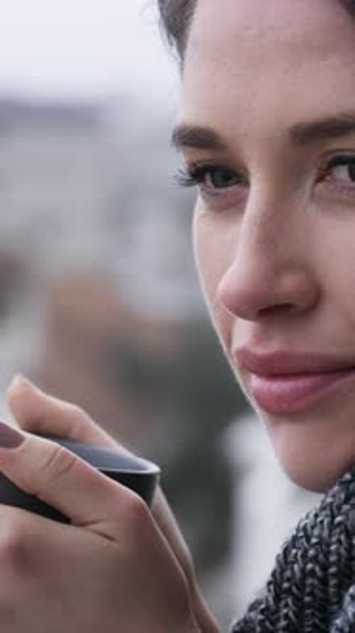 Woman, thinking and balcony with drink in city for morning beverage, start or dream in home