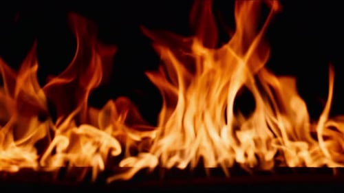 Fire Burning Flame Tongues of Orange Flame Bright Burning Flames on a Black Background Fire in Slow