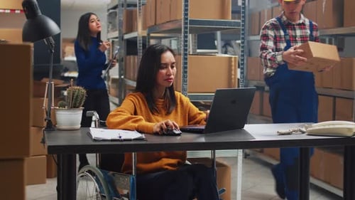 Asian Woman with Disability Working in Warehouse