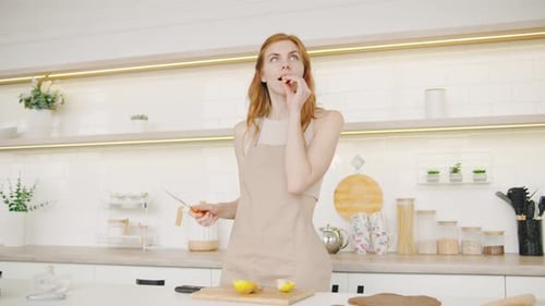 Woman Prepares Food in Bright Kitchen