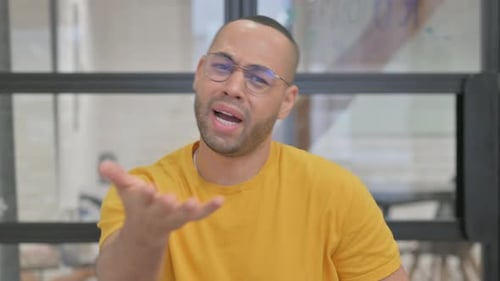 Adult Talking and Gesturing in an Office Setting