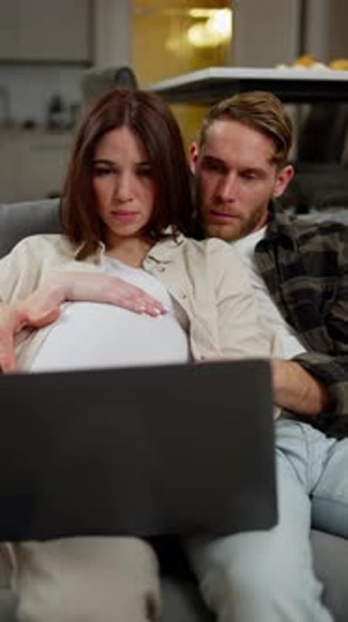 Vertical Video An Anxious and Sad Pregnant Brunette Girl with a Bob Hairstyle in a White Tshirt