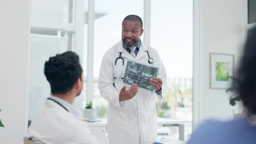 Doctors, meeting and xray talk for surgery planning, discussion and assessment in clinic