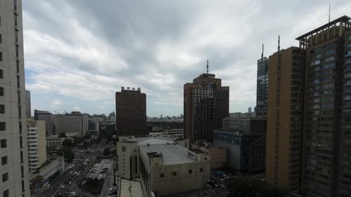 Timelapse of the Financial District of Beijing, China on a cloudy day during the summer.