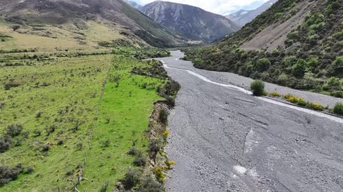 Aerial view of river flowing through valley in New Zealand