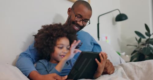 Father, boy and relax with tablet on bed at house for reading online ebook