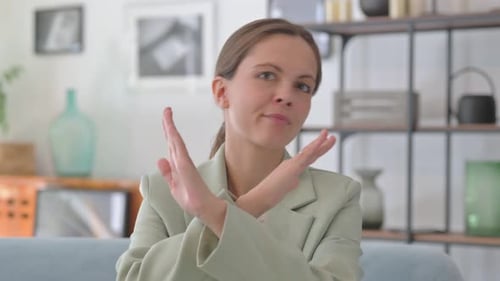 Young Businesswoman Rejecting Offer in Creative Office