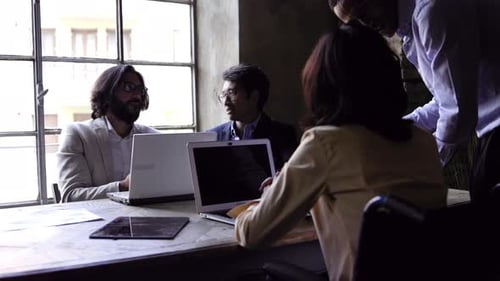 Multiracial business group of people working on financial strategy inside bank office