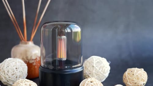 Aromatherapy Diffuser Releases Vapor in a Dark Setting