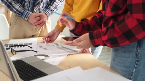 Young Adults Collaborating on a Project at Work