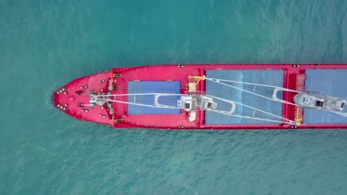 Large Cargo ship anchored away from port, Aerial view