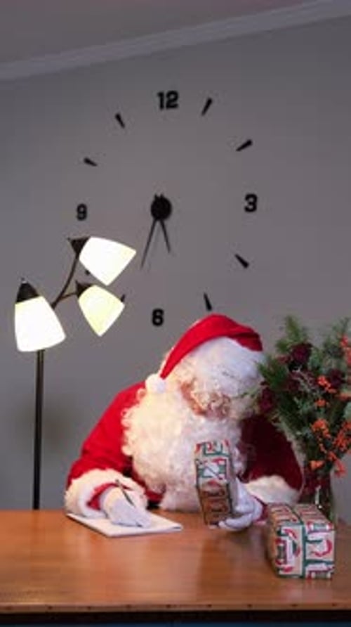 Santa Claus Writing His List and Checking It Twice