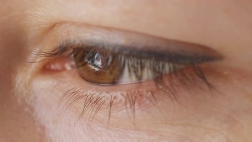 Woman's Hazel Eye Blicks in Extreme Close Up