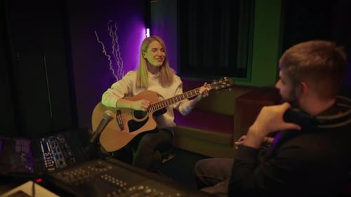 Woman Singer and Producer in Recording Studio Lady Guitarist Singing Song Audition and Meeting of
