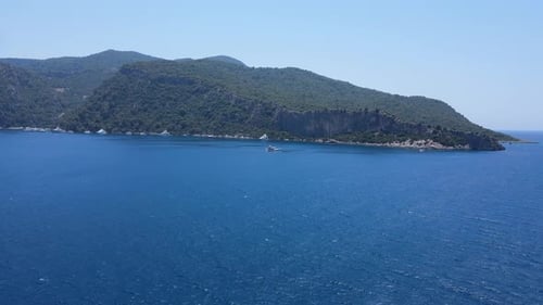 Beautiful view of the beach with boats, pure nature, sea and ships. Shot from a drone.