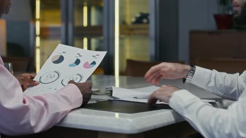 Business People Meet in Office and Shake Hands