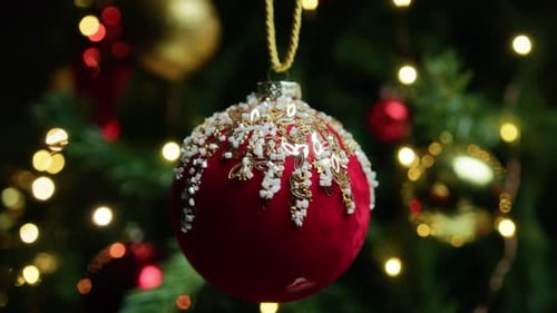 Festive Christmas Ornament Hanging on Decorated Tree