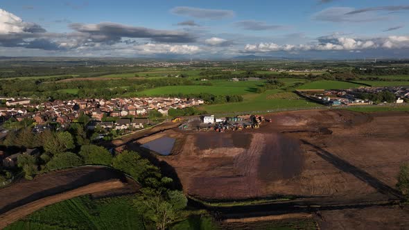Aerial orbiting shot showing the ground development for a housing ...