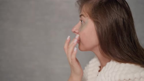 Woman Applies Skincare Eye Masks, Close Up