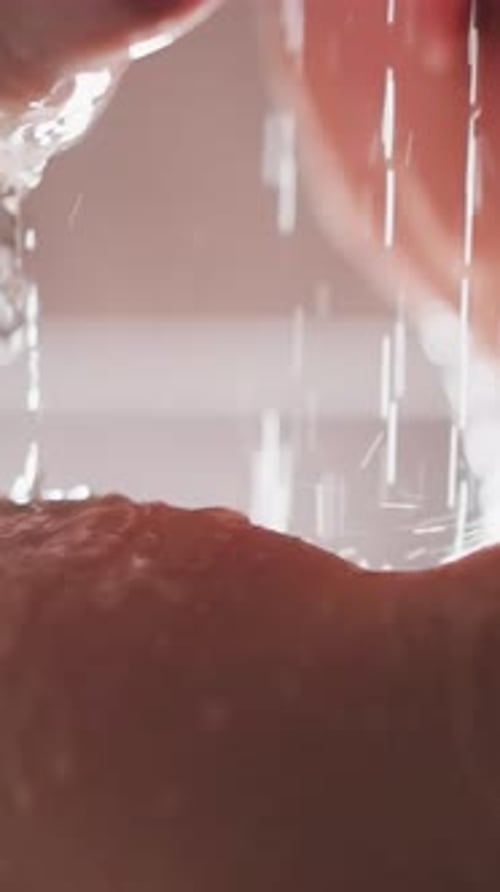 Water Droplets Flowing Down Arm Close-Up