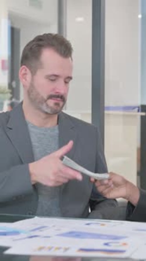 African Man Giving Money and Shaking Hand with Partner, vertical video