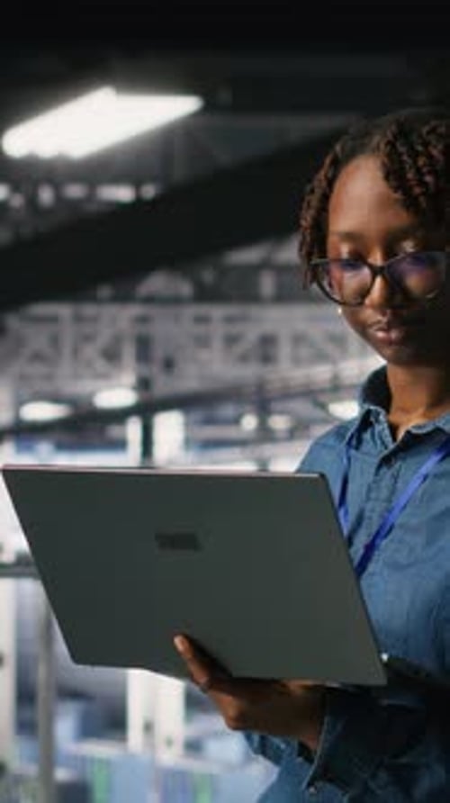 Vertical Video Data Center Software Developers Using Devices to Review AI LLM Visualizations