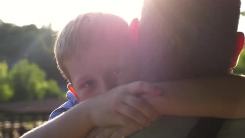 Loving Child Embracing Adult in Natural Setting