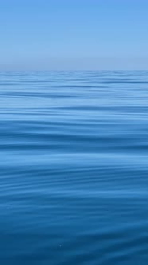 Ocean Water Ripples Vast Serene Blue Sea Under Clear Sky Tranquil Nautical Background