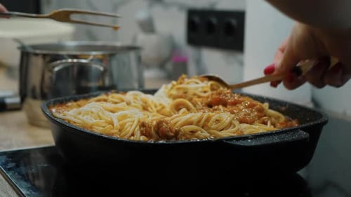 Cooking Spaghetti Bolognese in a Pan at Home