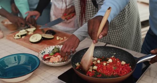 African Family Cooking Together At Home Patio - Closeup Shot Of Hands And Cooking Pan