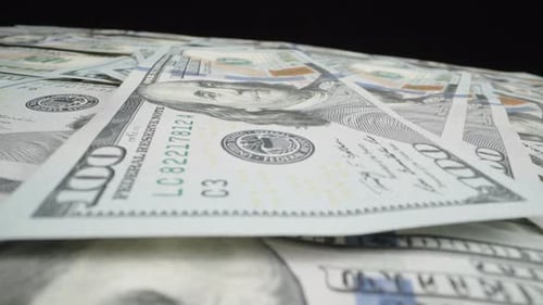 Pile of american dollars cash money counting on the table, inflation concept. Closeup new american o