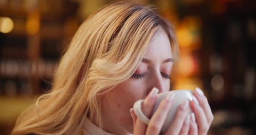 Drinking coffee, dream and woman in cafe for relax, espresso and latte in restaurant for morning