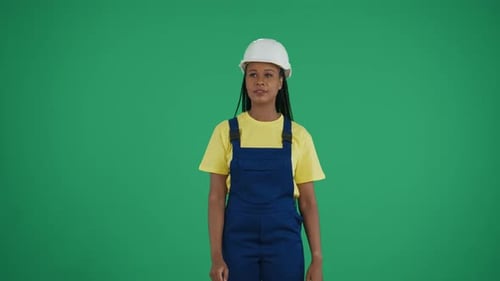 Medium Green Screen Isolated Chroma Key Video of a Darkskinned Young Female Construction Worker