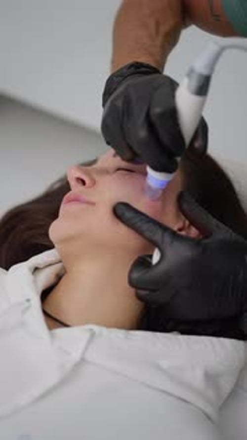 Woman Receiving a Cosmetic Facial Procedure