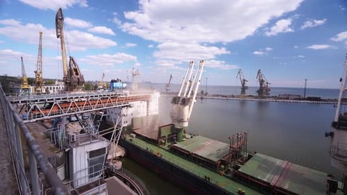 Wheat Loading to Bulker Ship Cargo Container at Sea Grain Terminal in Seaport Grain Shipment From