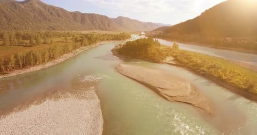 Low Altitude Flight Over Fresh Fast Mountain River with Rocks at Sunny Summer Morning