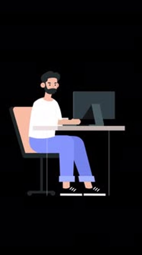 Bearded Male Employee Working in the Office Working on a Project on his Laptop Vertical Alpha