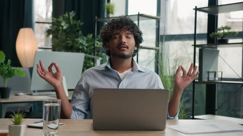 Calm Arabian Latin Man Indian Businessman Meditate at Office Desk Zen Meditation Relaxed Male