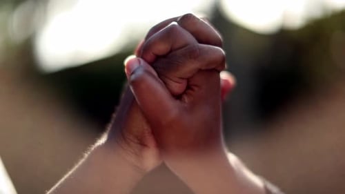 Hands Clasped Together Praying for Faith and Hope