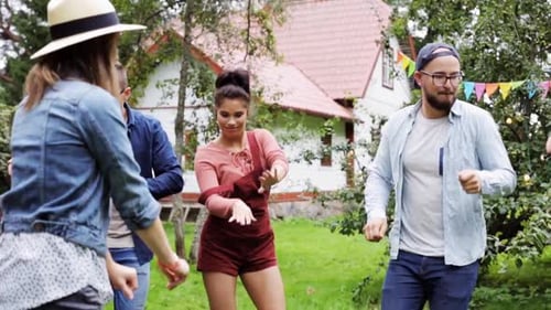 Friends Enjoying Party in Backyard on Sunny Day
