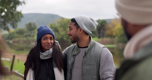 Friends Laughing and Chatting by the Lake