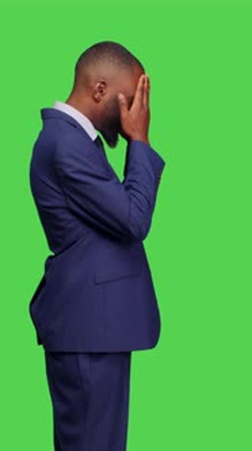Vertical Video Profile of Unhappy Businessman Dealing with Headache on Camera