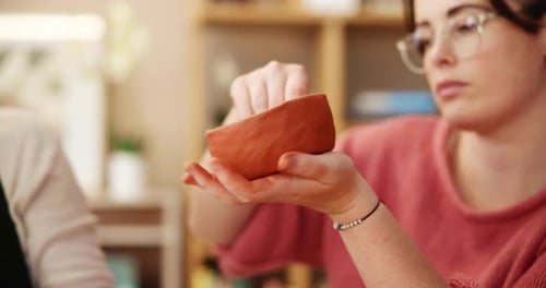 Woman, clay and bowl for pottery, art and creative workshop in ceramic store with tools