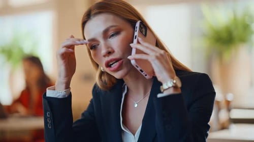 Wealthy Woman Negotiating Smartphone in Luxury Restaurant Closeup Businesswoman