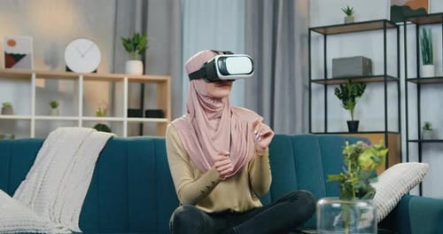 Woman Using Virtual Reality Headset in Living Room
