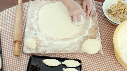 Woman Prepares Dough for Cooking