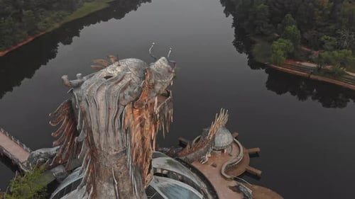 Circle around big dragon at Abandoned Waterpark. Hue, Vietnam, aerial